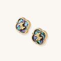 Gold-plated quatrefoil stud earrings featuring iridescent abalone shell centers with decorative motifs and crystal accents