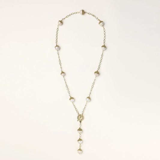 Long gold-plated lariat necklace featuring baroque pearls with metal caps arranged in elegant Y-shape design