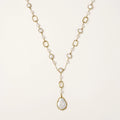 Y-shaped gold-plated necklace with freshwater pearls and geometric elements, featuring a baroque pearl pendant drop