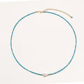 Delicate necklace featuring small turquoise apatite beads with a central freshwater pearl on sterling silver chain