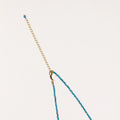 Delicate necklace featuring small turquoise apatite beads with a central freshwater pearl on sterling silver chain